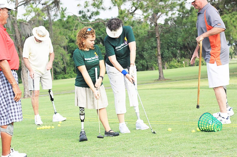 IMG_8687 amputee patient with a prosthetic leg playing gold