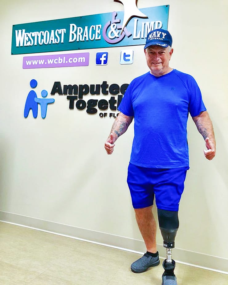 support2-2 leg amputee man, patient at clinic giving thumbs up