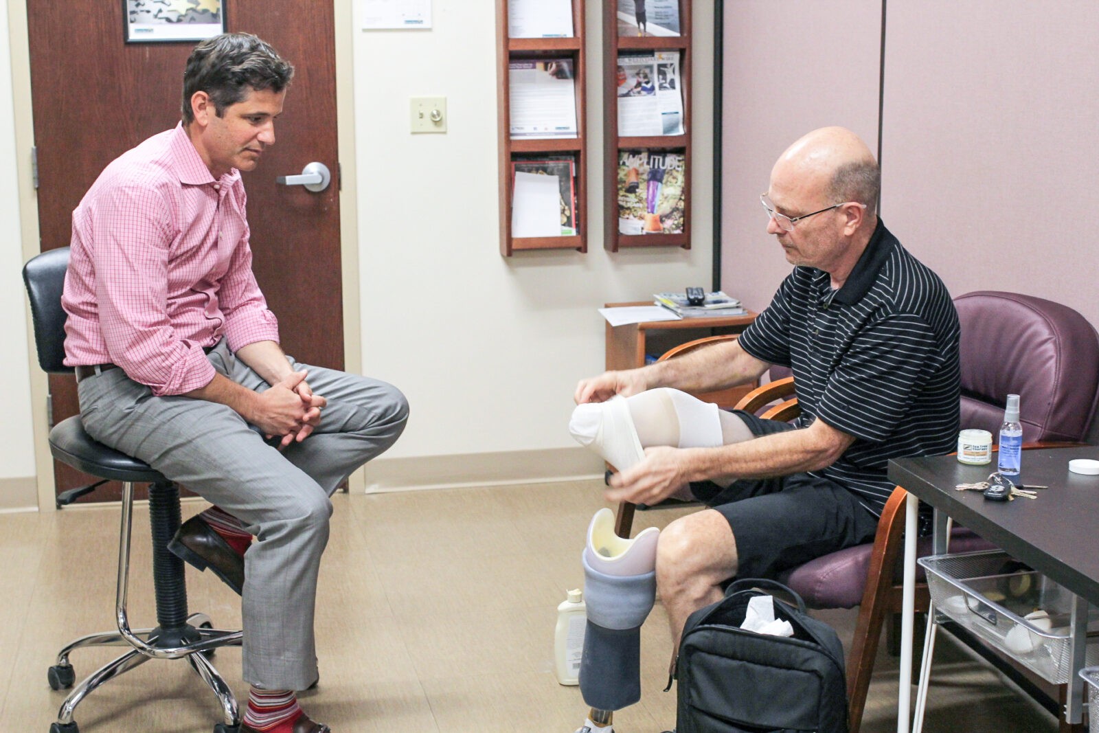 Leg amputee putting on Prosthetic leg