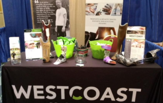exhibitor booth set up with table and pull up banners
