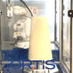 Robot Carver holding a full foam piece