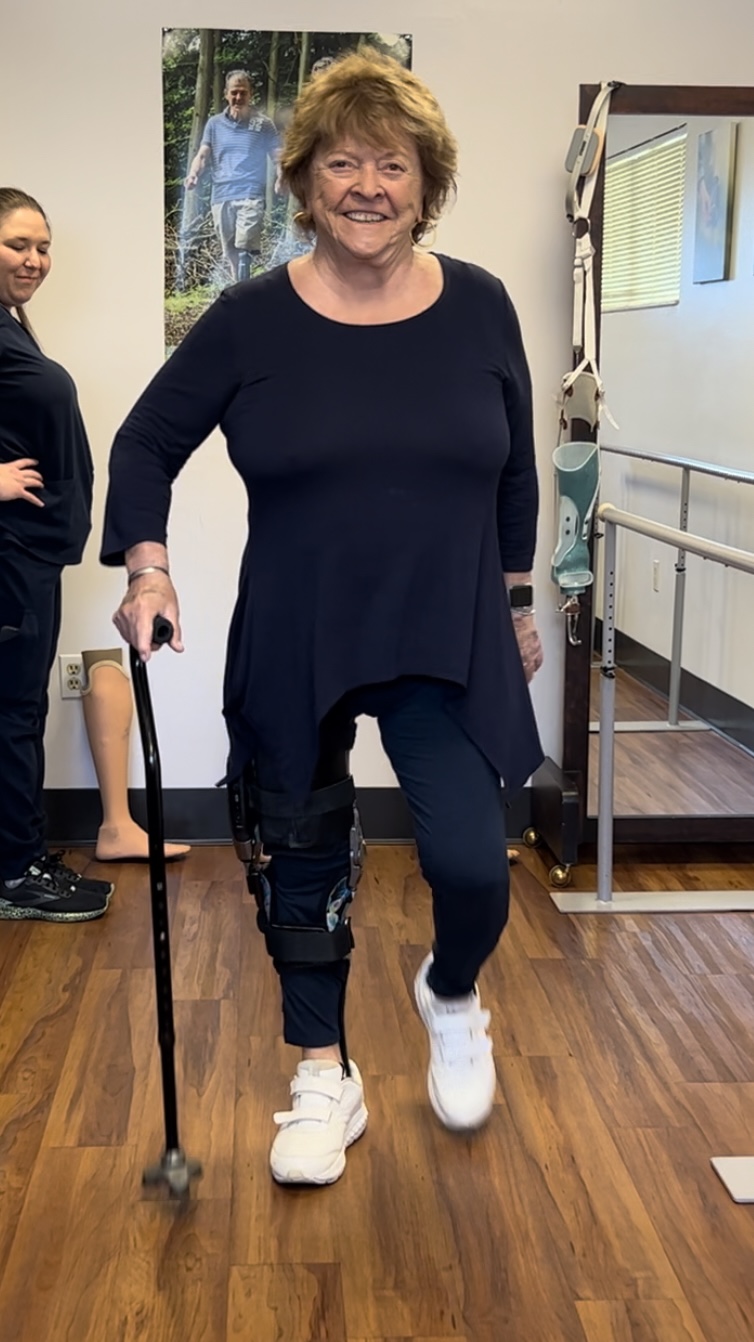 female patient standing in her ottobock c-brace